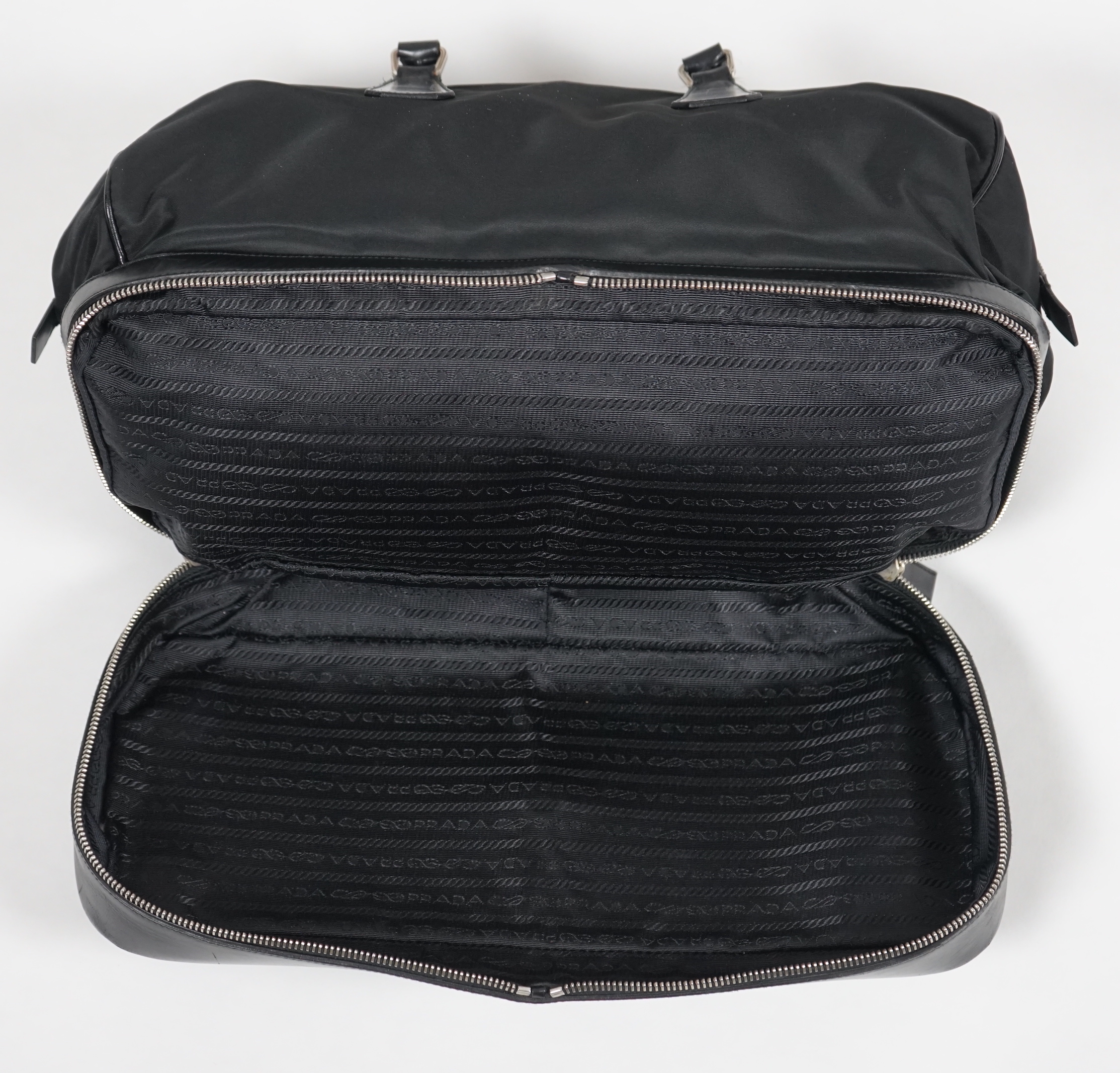 A Prada Tessuto black nylon and leather bag, width 38cm, height 23cm, depth 50cm